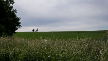 Obraz premium Clean fields and a lonely house in a beautiful landscape of Wallonia, Belgium