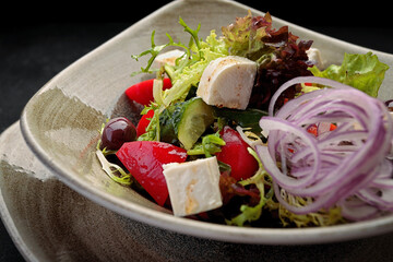 Fresh vegetable salad with cheese, on a plate