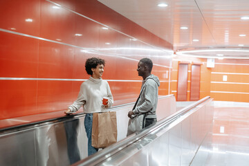 young couple of tourists climbing the stairs of the subway .