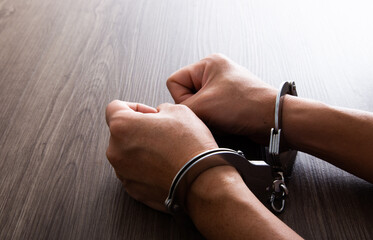 Arrested Man's Hand With Handcuffs