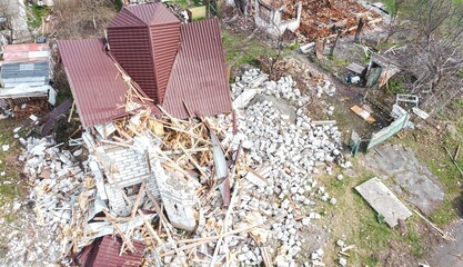 The war in Ukraine, destroyed a civilian house, destroyed by a shell project house. Drone view, aerial view