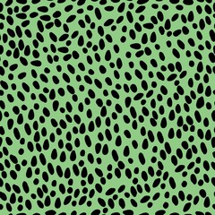 A simple pattern is abstract. Black spots on a bright green background. Fashionable print for textiles, wallpaper and packaging.