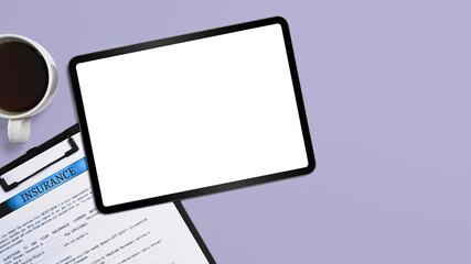 Top view digital tablet and insurance claim form on purple background. Blank screen for advertise text