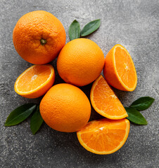 Fresh ripe oranges on dark background