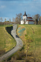 Urvaste Church Urvaste kirik Estonia National Geographic yellow frame travel southern sunset sunny green fields tree