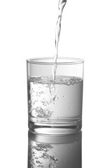 Water pouring into glasses isolated on a white