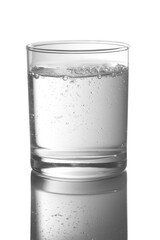 Glass full with water on a white