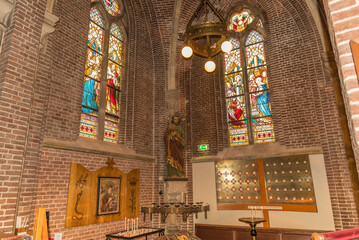 Alkmaar, Netherlands, May 2022. The interior of a church with religious artifacts.