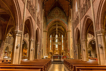 Alkmaar, Netherlands, May 2022. The interior of a church with religious artifacts.