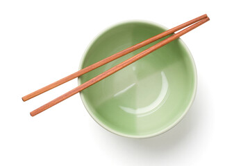 wooden chopsticks on a green bowl