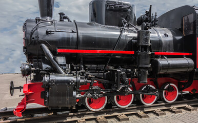 Fototapeta na wymiar Vintage antique steam locomotive or train engine