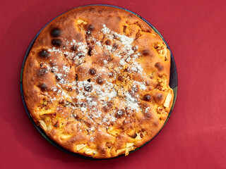 Homemade apple pie on a red background