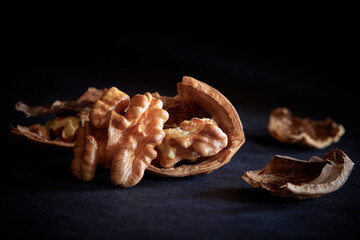 split walnut close-up on a dark background