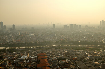Aerial view as smog covers Jakarta city during sunset