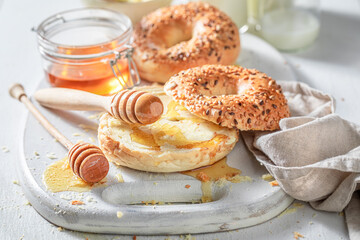 Sweet and healthy golden bagels with milk and honey.
