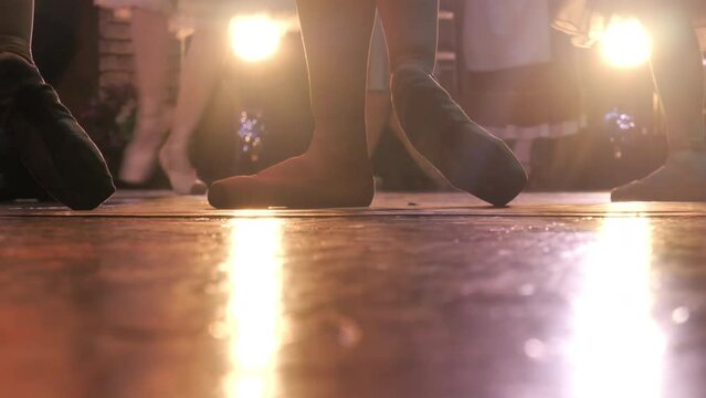 close-up of ballet dancer's feet performing on stage