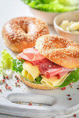 Delicious and healthy bagel with ham and cheese.