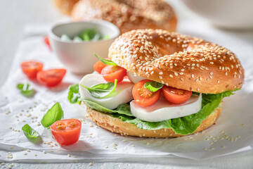 Healthy and fresh bagels with mozzarella and cherry tomatoes.