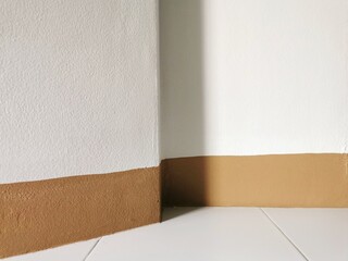 Abstract white wall with brown paint lines, white tiled floor, product background.