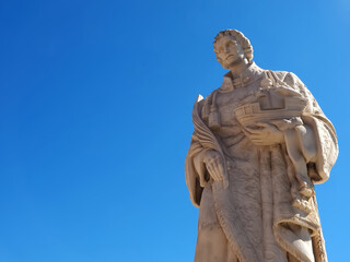 Obraz premium Isolated Sculpture of Saint Vincent or Sao Vicento, the patron of Lisbon, Portugal