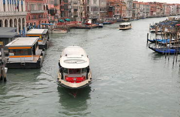 Ferry boat called vaporetto for the transport of people to the island of Venice in the Grand Canal without other boats sailing because there is the italian lockdown