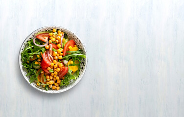 Summer healthy vegetables salad with cucumber, chickpeas and tomato. Healthy food.Top view.