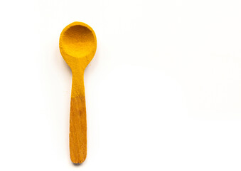 Healthy Eating Concept with Turmeric Superfood Powder in Wooden Spoon on White Background. Vegetarian and Vegan Diet
