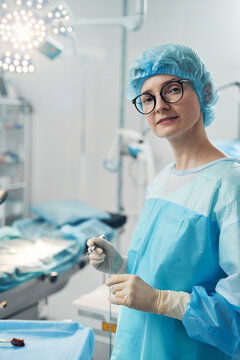 Surgeon assistant with electrosurgical pencil staring into camera