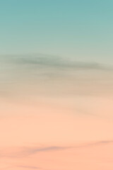 Vertical ratio size of sunset background. sky with soft and blur pastel colored clouds. gradient cloud on the beach resort. nature. sunrise.  peaceful morning. Instagram toned style