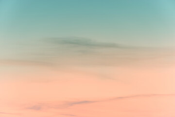 sunset background. sky with soft and blur pastel colored clouds.  gradient cloud on the beach resort. nature. sunrise.  peaceful morning. Instagram toned style