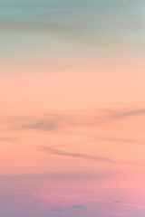 Vertical ratio size of sunset background. sky with soft and blur pastel colored clouds. gradient cloud on the beach resort. nature. sunrise.  peaceful morning. Instagram toned style
