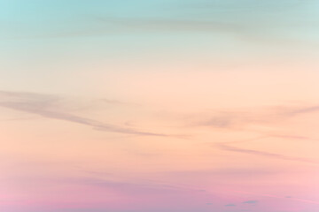 Fototapeta premium sunset background. sky with soft and blur pastel colored clouds. gradient cloud on the beach resort. nature. sunrise. peaceful morning. Instagram toned style