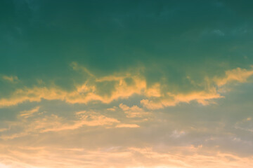 Fototapeta premium sunset background. sky with soft and blur pastel colored clouds. gradient cloud on the beach resort. nature. sunrise. peaceful morning. Instagram toned style