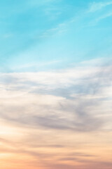 Vertical ratio size of sunset background. sky with soft and blur pastel colored clouds. gradient cloud on the beach resort. nature. sunrise.  peaceful morning. Instagram toned style