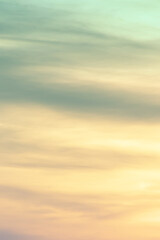 Vertical ratio size of sunset background. sky with soft and blur pastel colored clouds. gradient cloud on the beach resort. nature. sunrise.  peaceful morning. Instagram toned style