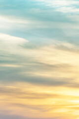 Vertical ratio size of sunset background. sky with soft and blur pastel colored clouds. gradient cloud on the beach resort. nature. sunrise.  peaceful morning. Instagram toned style