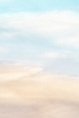 Obraz premium Vertical ratio size of sunset background. sky with soft and blur pastel colored clouds. gradient cloud on the beach resort. nature. sunrise. peaceful morning. Instagram toned style