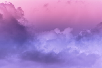 Twilight sky with effect of light pastel pink colors. Colorful sunset of soft clouds.