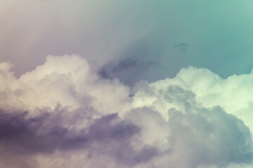 Twilight sky with effect of light pastel turquoise colors. Colorful sunset of soft clouds.