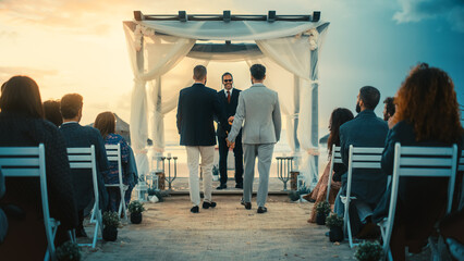 Handsome Gay Couple Walking Down the Aisle at Outdoors Wedding Ceremony Venue Near the Ocean. Two...