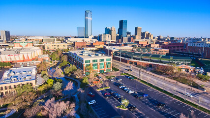 Aerial of shopping center and downtown of Oklahoma City in morning