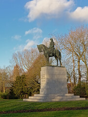 Bronze equestrian statue of Belgian king Albert I on a sunnyy winter day in a park in Bruges,...