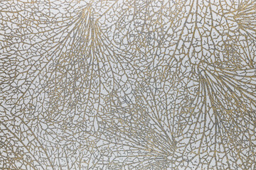 Textile tapestry background with a gold glitter texture