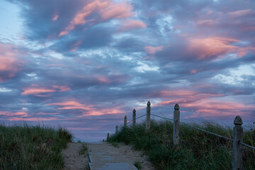 Wooden path leading to the ocean at sunset. Atlantic Ocean. Maine. USA