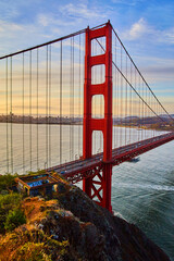 Glorious sunrise light hitting red Golden Gate Bridge in San Francisco