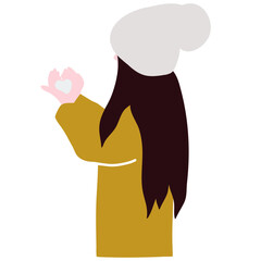 A girl in a yellow warm jacket and a hat holds snow in her hands