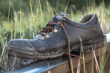 Boots, old shoes. Worn shoes on the railway.