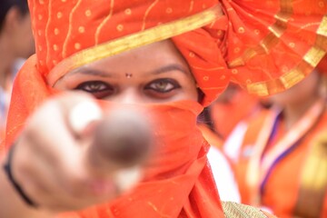 Face Of Maharashtrian Drummer Woman In Orange Dress