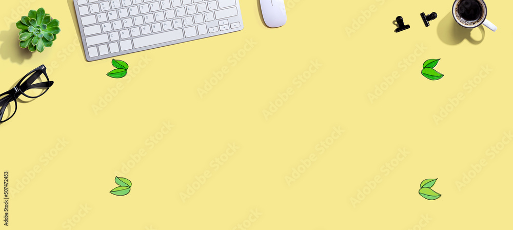 Poster green leaves with a computer keyboard and a mouse