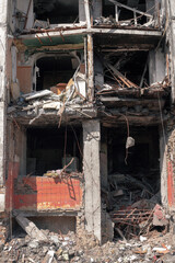 The entrance to a residential panel house destroyed by a missile. Entrance of the house after being hit by an air bomb